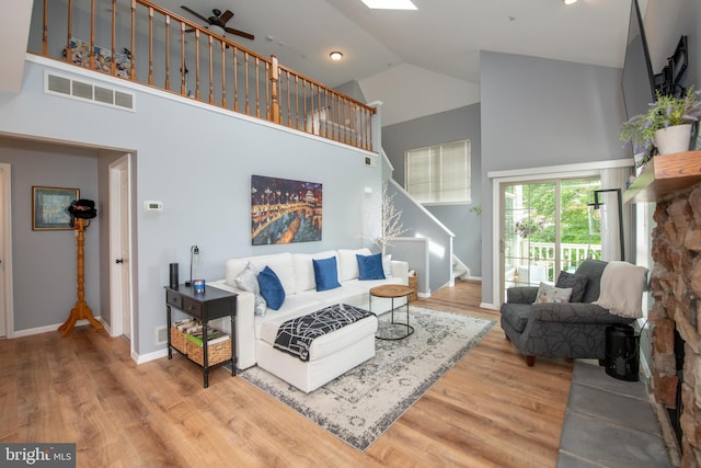 604 Remington Ct, Chalfont, PA 18914 - living room featuring high vaulted ceiling, stairway, wood finished floors, and baseboards