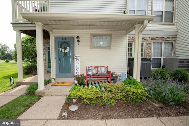 604 Remington Ct, Chalfont, PA 18914 - entrance to property featuring a porch, central air condition unit, and stone siding