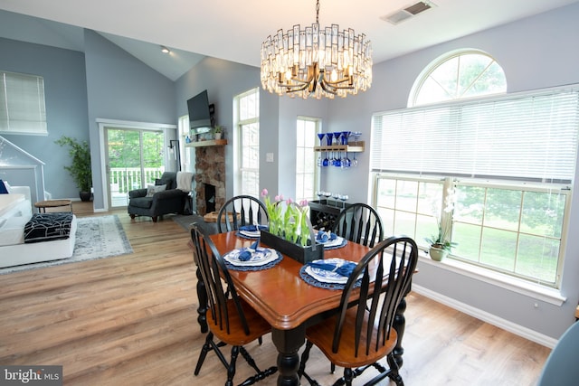 604 Remington Ct, Chalfont, PA 18914 - dining room featuring wood finished floors, a chandelier, healthy amount of natural light, vaulted ceiling, and baseboards