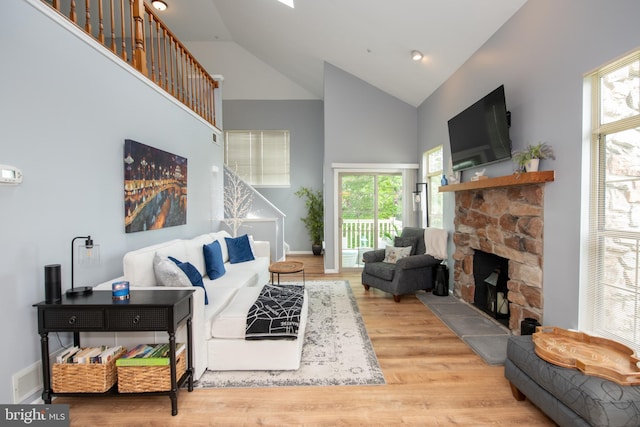 604 Remington Ct, Chalfont, PA 18914 - living area featuring high vaulted ceiling, wood finished floors, a fireplace, and baseboards