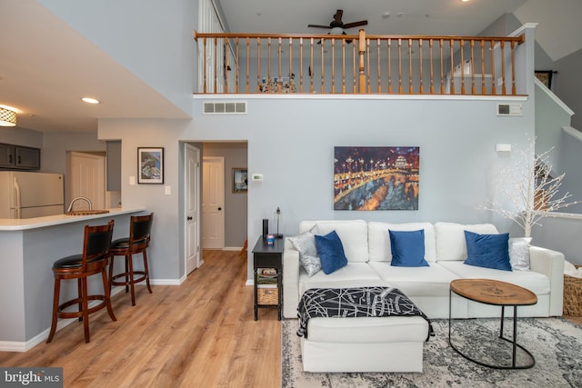 604 Remington Ct, Chalfont, PA 18914 - living room with wood finished floors, ceiling fan, baseboards, a towering ceiling, and recessed lighting