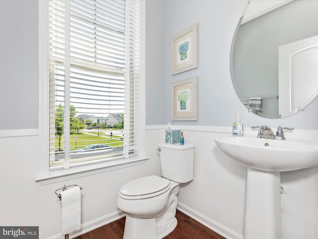 6540 Newton Dr, Frederick, MD 21703 - half bathroom featuring a wainscoted wall, toilet, wood finished floors, and a sink