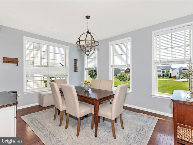 6540 Newton Dr, Frederick, MD 21703 - dining room featuring a chandelier, plenty of natural light, dark wood-style flooring, and baseboards