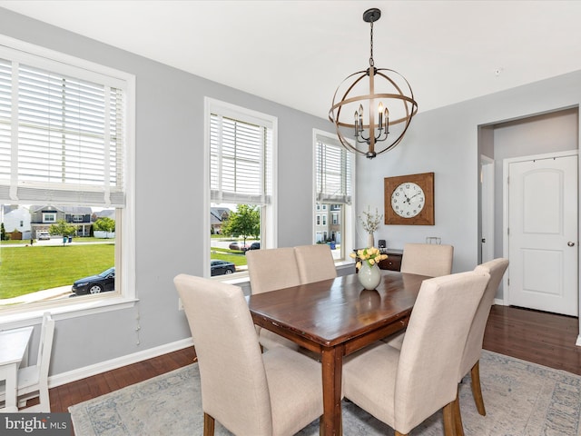 6540 Newton Dr, Frederick, MD 21703 - dining room featuring a chandelier, wood finished floors, and baseboards