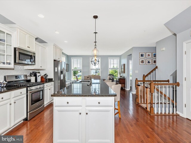 6540 Newton Dr, Frederick, MD 21703 - kitchen with stainless steel appliances, dark wood finished floors, white cabinets, tasteful backsplash, and recessed lighting