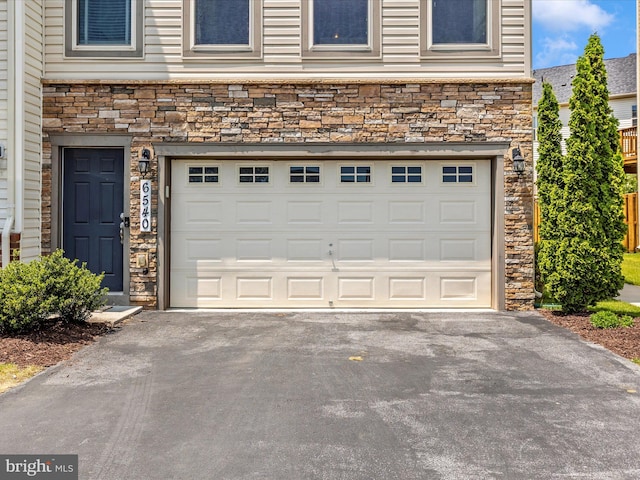 6540 Newton Dr, Frederick, MD 21703 - garage featuring asphalt driveway