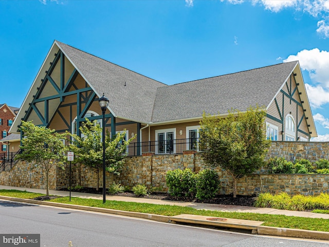 6540 Newton Dr, Frederick, MD 21703 - view of front of home with a shingled roof and stone siding