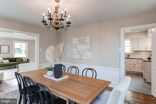827 S Pine St, York, PA 17403 - dining room featuring plenty of natural light, wood finished floors, and a chandelier