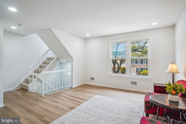 7 Supreme Ct Unit 23-4, Gaithersburg, MD 20878 - living area featuring wood finished floors, baseboards, recessed lighting, and an upstairs landing
