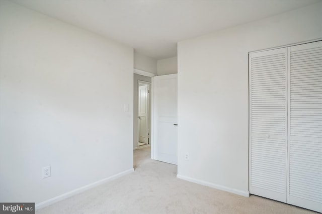 7 Supreme Ct Unit 23-4, Gaithersburg, MD 20878 - unfurnished bedroom with baseboards, light colored carpet, and a closet