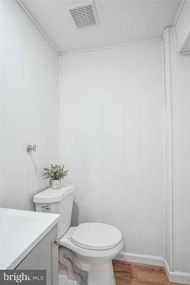 7 Supreme Ct Unit 23-4, Gaithersburg, MD 20878 - bathroom featuring toilet, wood finished floors, and vanity
