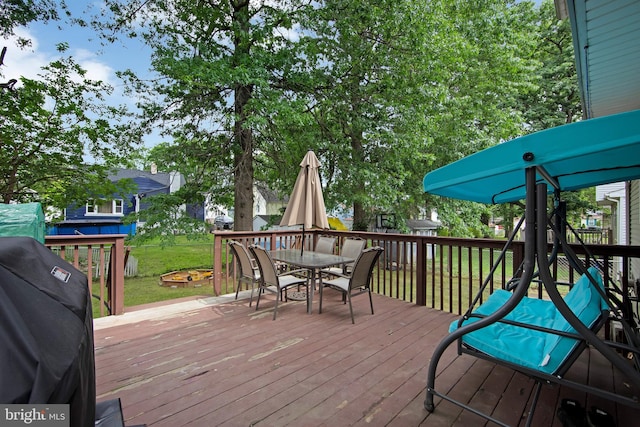 26 Juniper Ave, Somerdale, NJ 08083 - wooden deck with outdoor dining area, area for grilling, and a lawn