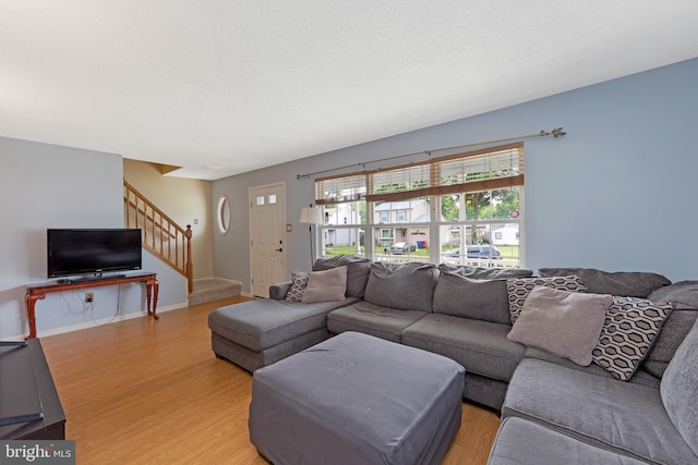 26 Juniper Ave, Somerdale, NJ 08083 - living area with stairs, light wood-style flooring, and baseboards