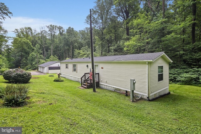 2519 Shureslanding Rd, Darlington, MD 21034 - rear view of property with an outdoor structure, a lawn, a garage, and a view of trees