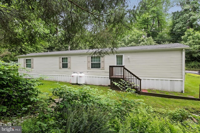 2519 Shureslanding Rd, Darlington, MD 21034 - back of property featuring a lawn and view of wooded area