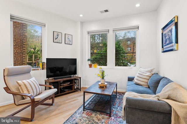 329 Rhode Island Ave NE Unit 104, Washington, DC 20002 - living area with plenty of natural light, light wood-type flooring, recessed lighting, and baseboards