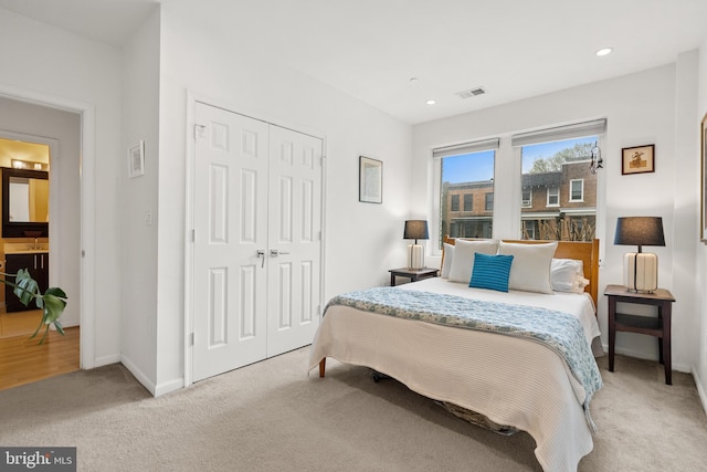 329 Rhode Island Ave NE Unit 104, Washington, DC 20002 - bedroom with light colored carpet, a closet, baseboards, recessed lighting, and a sink