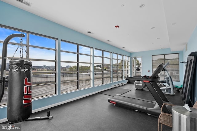 329 Rhode Island Ave NE Unit 104, Washington, DC 20002 - exercise room featuring a water view and baseboards