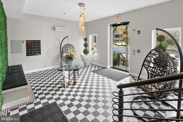 329 Rhode Island Ave NE Unit 104, Washington, DC 20002 - entryway with tile patterned floors, a wall unit AC, and baseboards