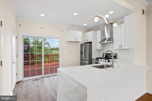 42038 Angel Arch Ter, Aldie, VA 20105 - kitchen with wall chimney exhaust hood, stainless steel appliances, crown molding, light stone counters, and a peninsula