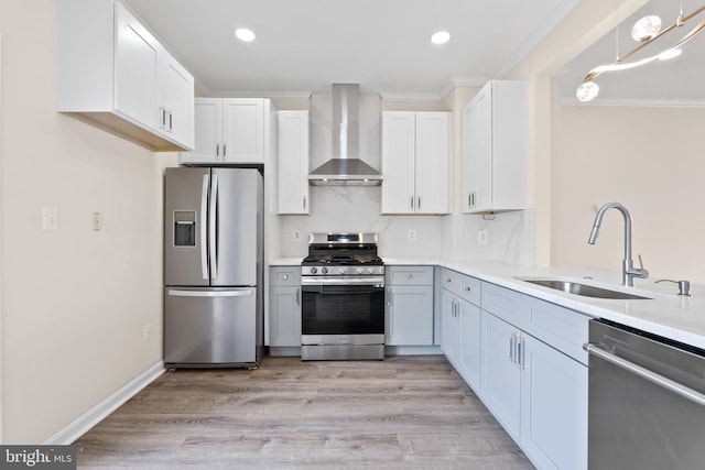 42038 Angel Arch Ter, Aldie, VA 20105 - kitchen featuring stainless steel appliances, wall chimney range hood, a sink, light countertops, and crown molding