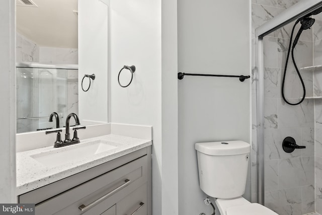 42038 Angel Arch Ter, Aldie, VA 20105 - full bathroom featuring vanity, a marble finish shower, and toilet