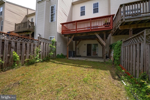42038 Angel Arch Ter, Aldie, VA 20105 - back of property with central AC unit, a patio area, and a wooden deck