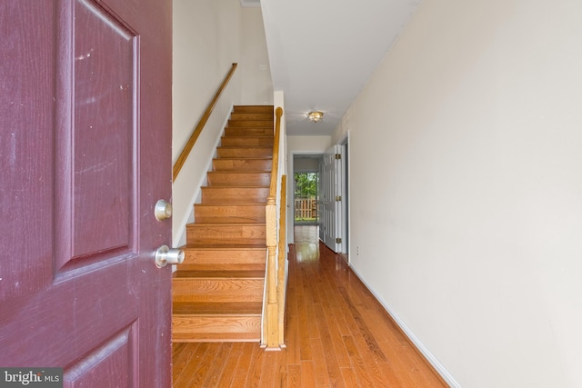 42038 Angel Arch Ter, Aldie, VA 20105 - foyer entrance featuring wood finished floors, stairs, and baseboards