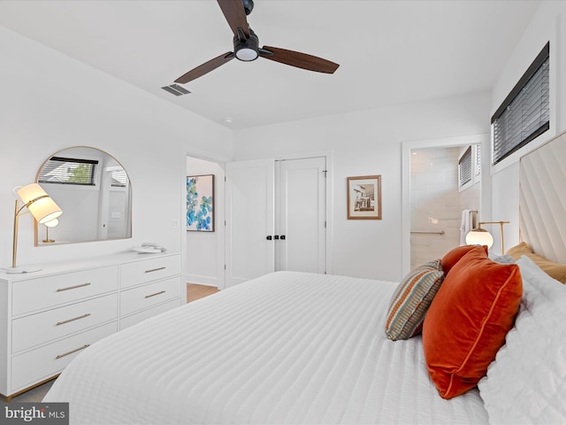 137 Cornwall Rd, Rehoboth Beach, DE 19971 - bedroom with connected bathroom, ceiling fan, and a closet