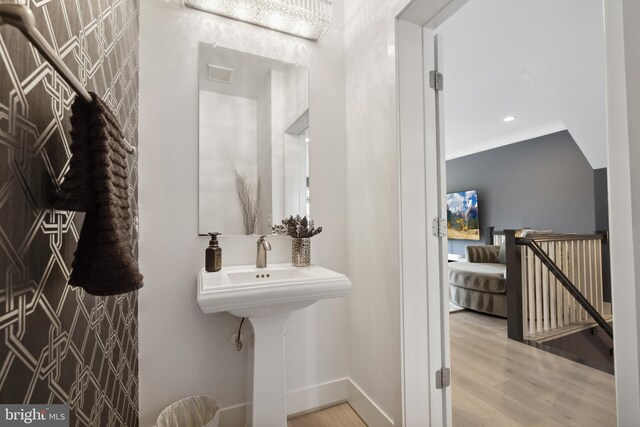 141 Center St S Unit 6, Vienna, VA 22180 - bathroom with wood finished floors, baseboards, and ornamental molding