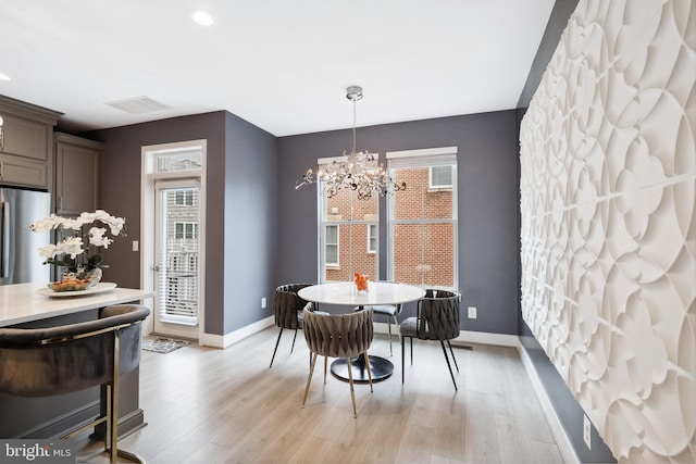 141 Center St S Unit 6, Vienna, VA 22180 - dining room with healthy amount of natural light, baseboards, and a chandelier