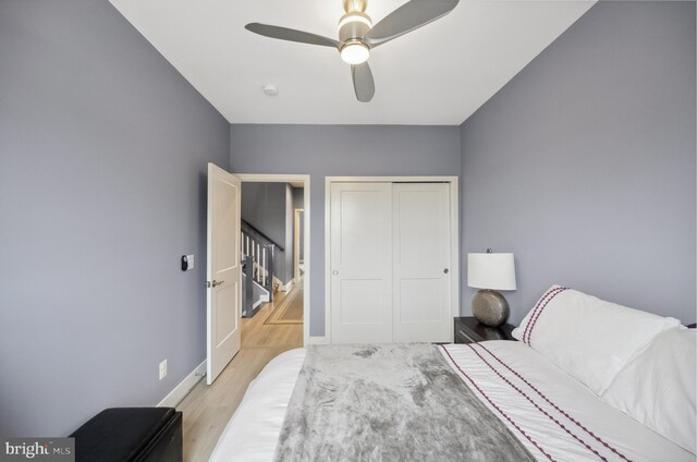 141 Center St S Unit 6, Vienna, VA 22180 - bedroom with light wood-style flooring, a closet, baseboards, and ceiling fan