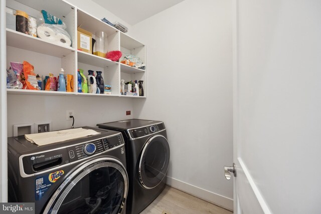 141 Center St S Unit 6, Vienna, VA 22180 - laundry room with independent washer and dryer, wood finished floors, and baseboards