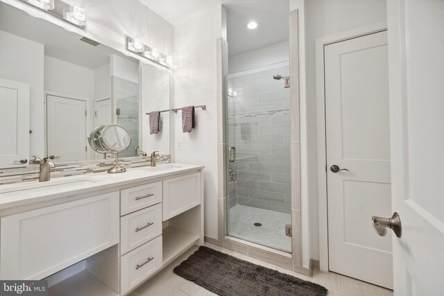 141 Center St S Unit 6, Vienna, VA 22180 - bathroom with a stall shower, double vanity, recessed lighting, and tile patterned flooring