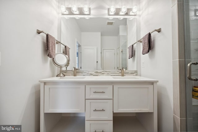 141 Center St S Unit 6, Vienna, VA 22180 - bathroom featuring double vanity and a shower with shower door