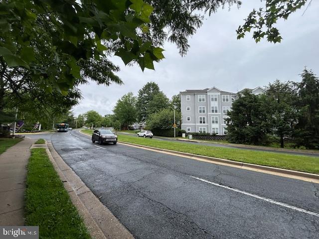 18500 Boysenberry Unit 145-51, Gaithersburg, MD 20879 - view of asphalt road featuring curbs and sidewalks