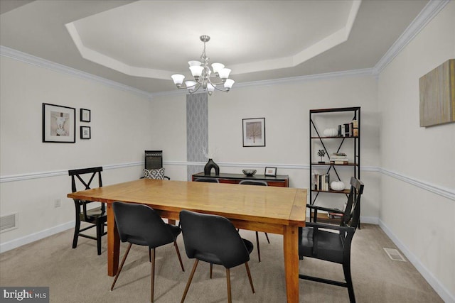749 Seem Dr, Kutztown, PA 19530 - dining area with a raised ceiling, a chandelier, light colored carpet, crown molding, and baseboards