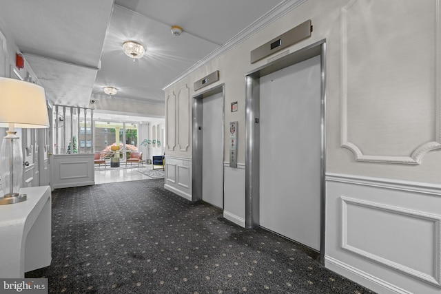 1301 N Harrison St Unit 708, Wilmington, DE 19806 - corridor featuring elevator, ornamental molding, carpet, and a decorative wall