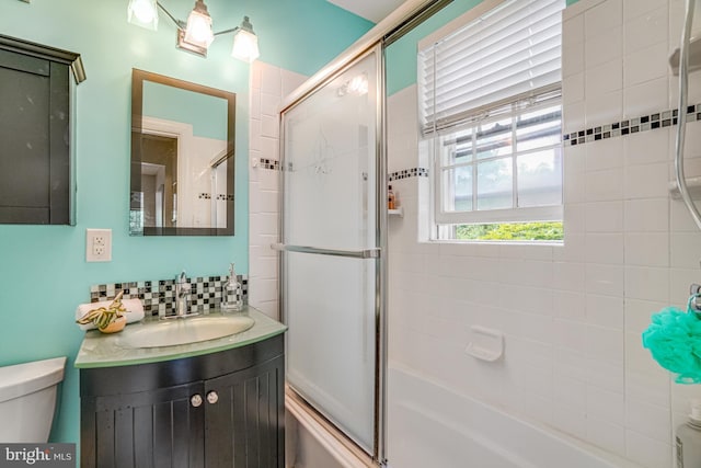 715 S Washington St Unit A-13, Alexandria, VA 22314 - full bathroom featuring toilet, vanity, enclosed tub / shower combo, and decorative backsplash