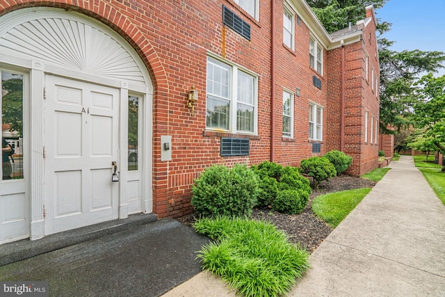 715 S Washington St Unit A-13, Alexandria, VA 22314 - property entrance with brick siding
