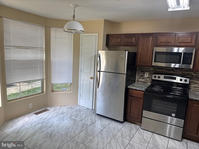 10749 Kitchener Ct, Bowie, MD 20721 - kitchen with stainless steel appliances, tasteful backsplash, light marble finish flooring, and stone counters