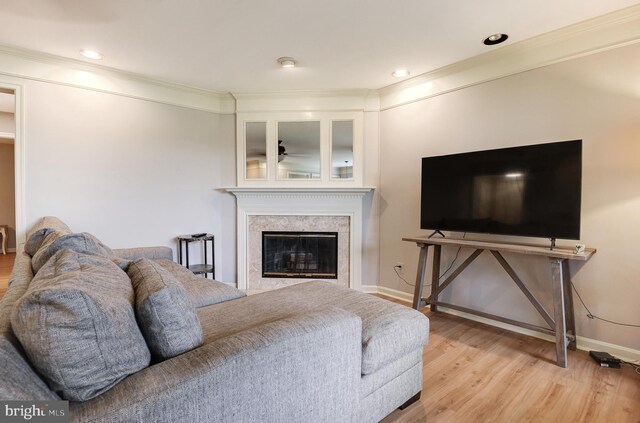 8060 Stonewall Brigade Ct Unit 101, Manassas, VA 20109 - living area featuring wood finished floors, a high end fireplace, ornamental molding, baseboards, and ceiling fan