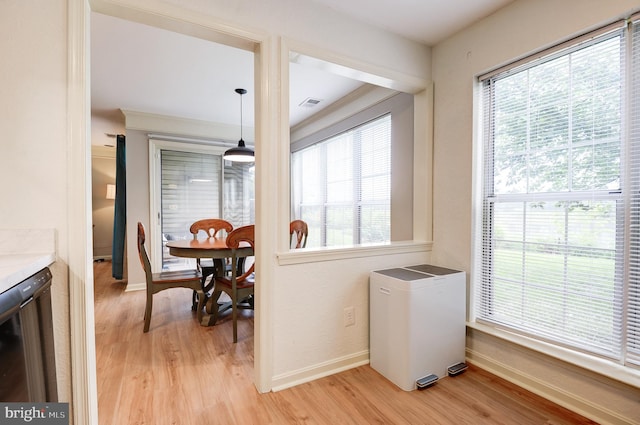 8060 Stonewall Brigade Ct Unit 101, Manassas, VA 20109 - dining space with light wood-style floors, plenty of natural light, and baseboards