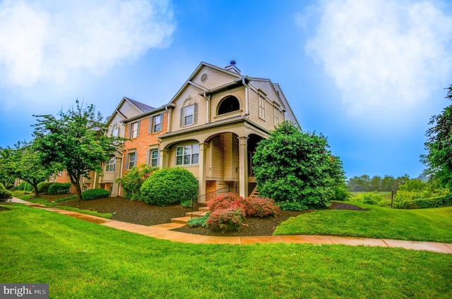 8060 Stonewall Brigade Ct Unit 101, Manassas, VA 20109 - traditional-style house featuring a front yard