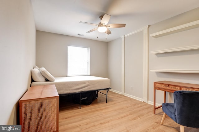 8060 Stonewall Brigade Ct Unit 101, Manassas, VA 20109 - bedroom with light wood-style flooring, baseboards, and a ceiling fan