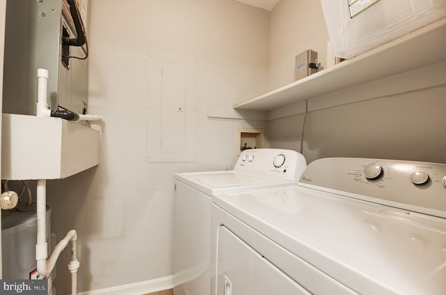 8060 Stonewall Brigade Ct Unit 101, Manassas, VA 20109 - laundry room with separate washer and dryer and baseboards