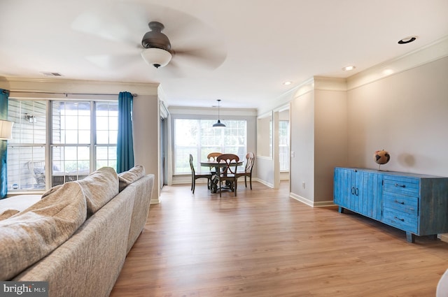 8060 Stonewall Brigade Ct Unit 101, Manassas, VA 20109 - living room with crown molding, baseboards, light wood-type flooring, and ceiling fan
