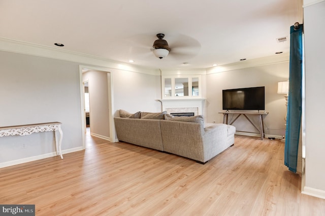 8060 Stonewall Brigade Ct Unit 101, Manassas, VA 20109 - living area featuring ceiling fan, crown molding, light wood finished floors, a fireplace, and baseboards