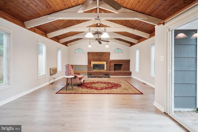 12804 Brunswick Ln, Bowie, MD 20715 - living area featuring a ceiling fan, a fireplace, wood finished floors, a wall mounted air conditioner, and wood ceiling