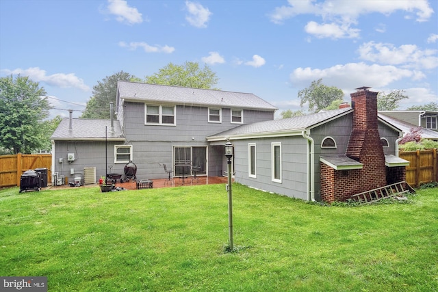 12804 Brunswick Ln, Bowie, MD 20715 - rear view of house with a shingled roof and a chimney